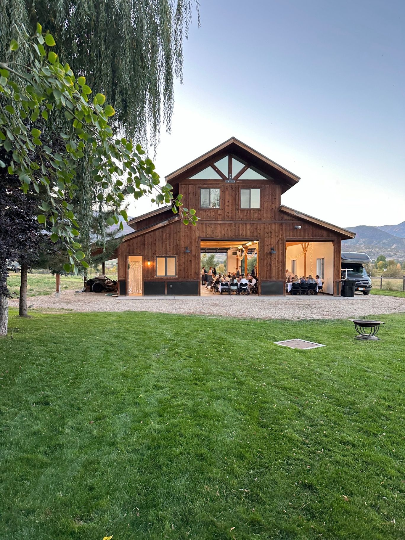 Evening gathering at the barn under the willow tree